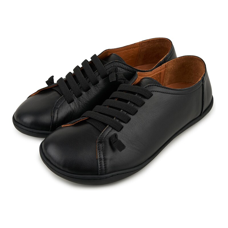Vlnka Dámské kožené barefoot tenisky na gumu Onyx černá 115137077
