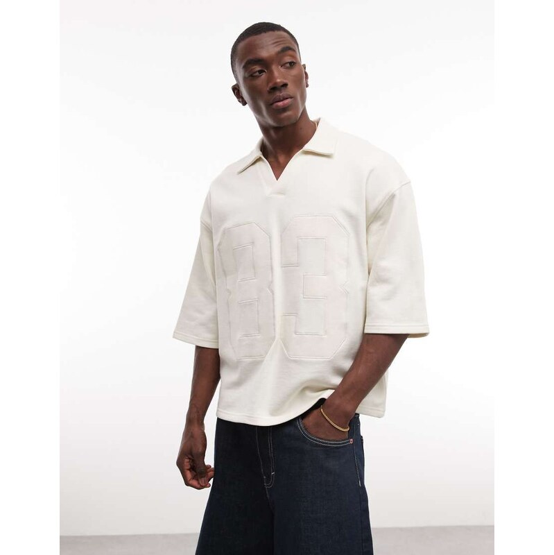 ASOS DESIGN oversized boxy fit polo with applique detail in cream-White