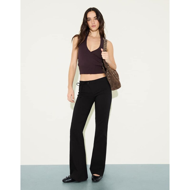 Bershka Low-rise flared trousers in black
