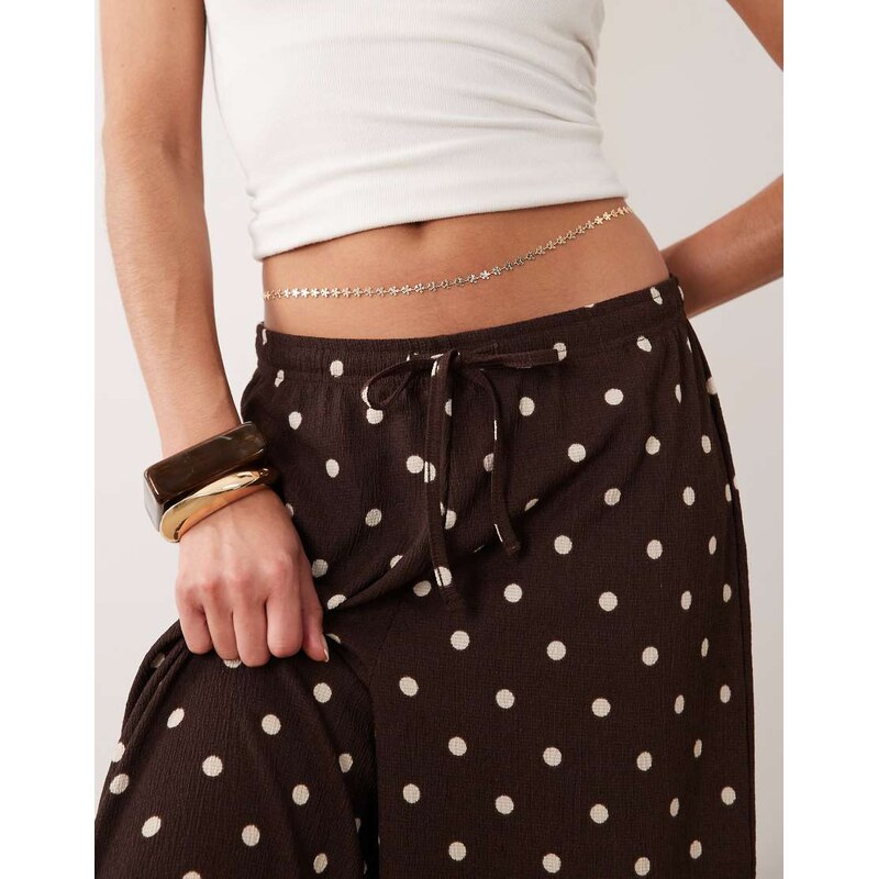 ASOS DESIGN belly chain with flower design in gold tone 115299718