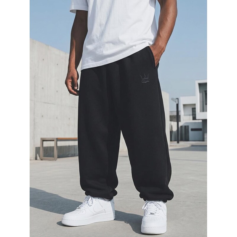 Pánské černé volné tepláky Jigga Wear s výšivkou koruny