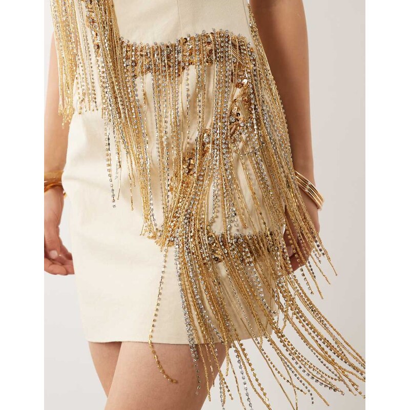 ASOS DESIGN curved bandeau mini dress with gold tassel embellished fringe in cream-Neutral