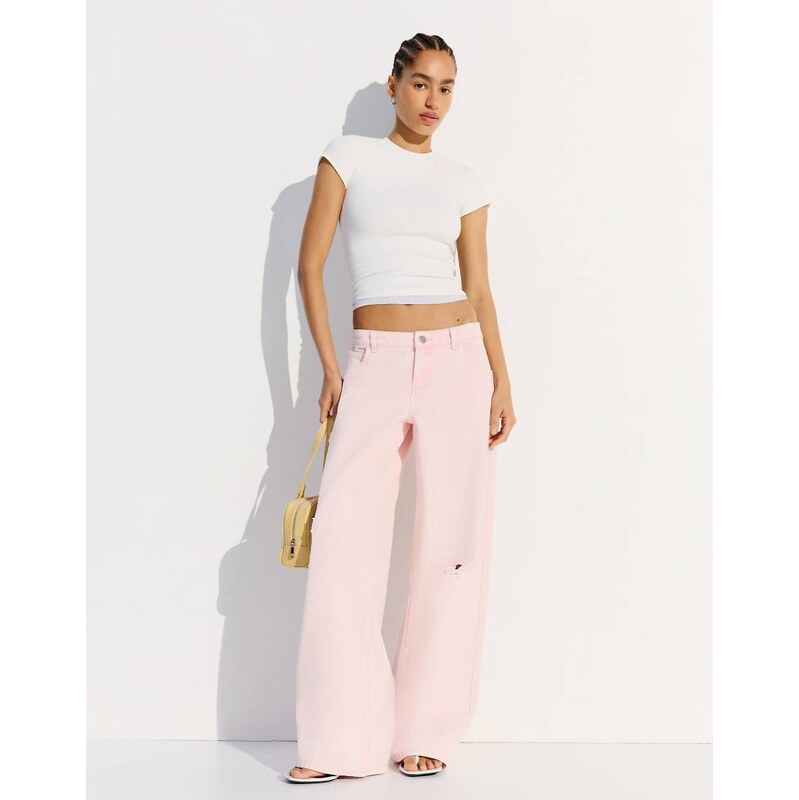 Bershka Ripped washed-effect trousers in washed pink