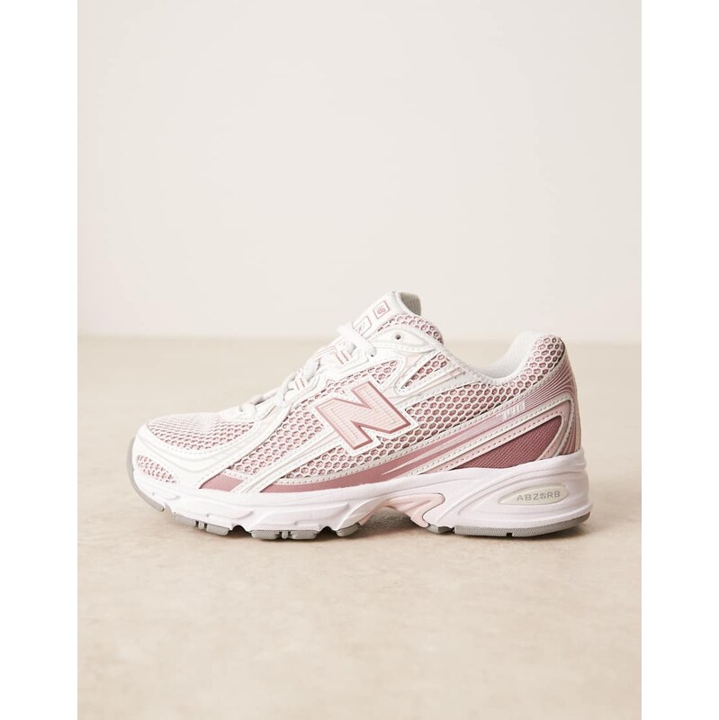 New Balance 740 trainers in white and light pink