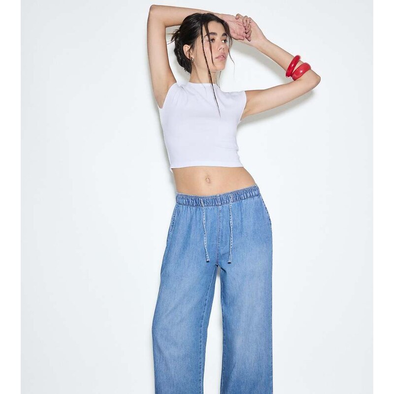 Stradivarius Petite flowy denim trousers with drawstring in medium 115380027