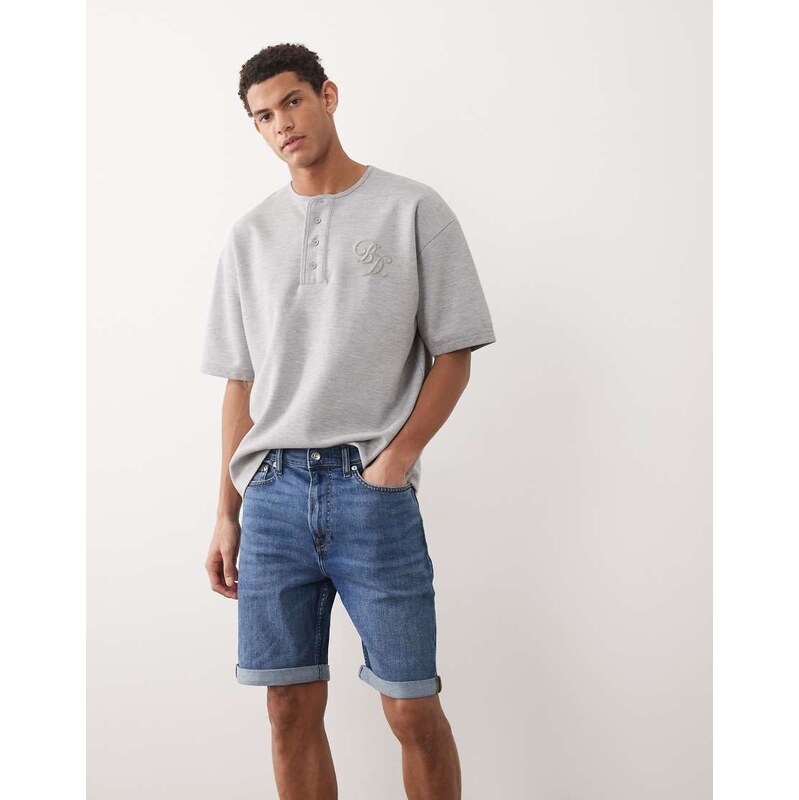 Calvin Klein Jeans slim denim shorts in mid wash blue