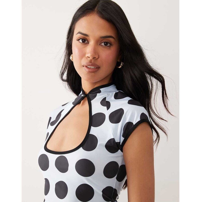 ASOS DESIGN printed short sleeve cut out top in brown and blue
