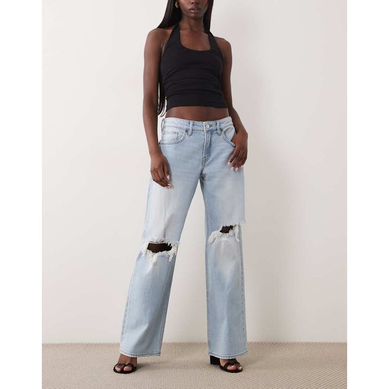 Good American low waist baggy fit rip jean in light blue wash 115634268