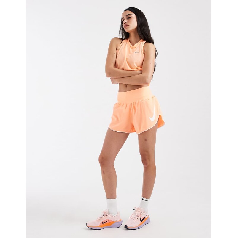 Nike Running Tempo Dri-FIT mid rise swoosh shorts in orange