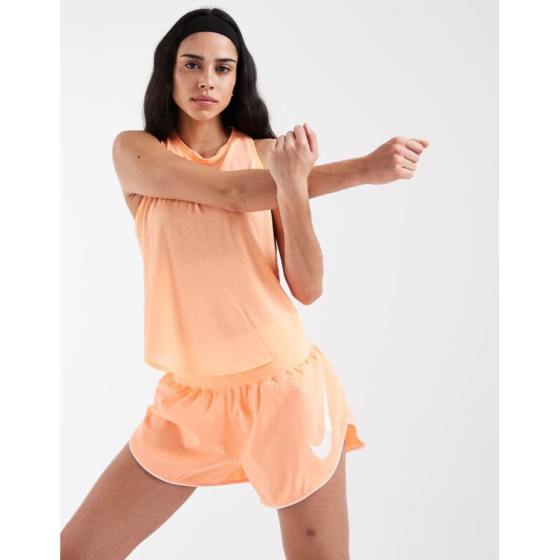 Nike Running Tempo Dri-FIT mid rise swoosh shorts in orange