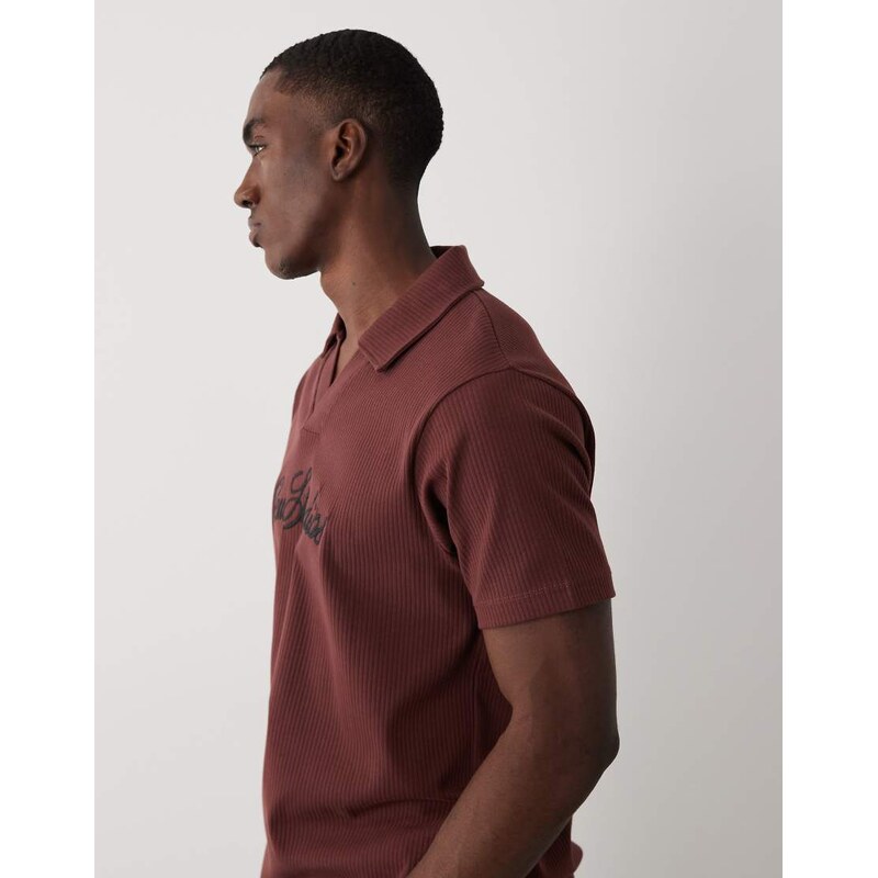 ASOS DESIGN super heavyweight regular fit polo with text graphic in brown rib fabric