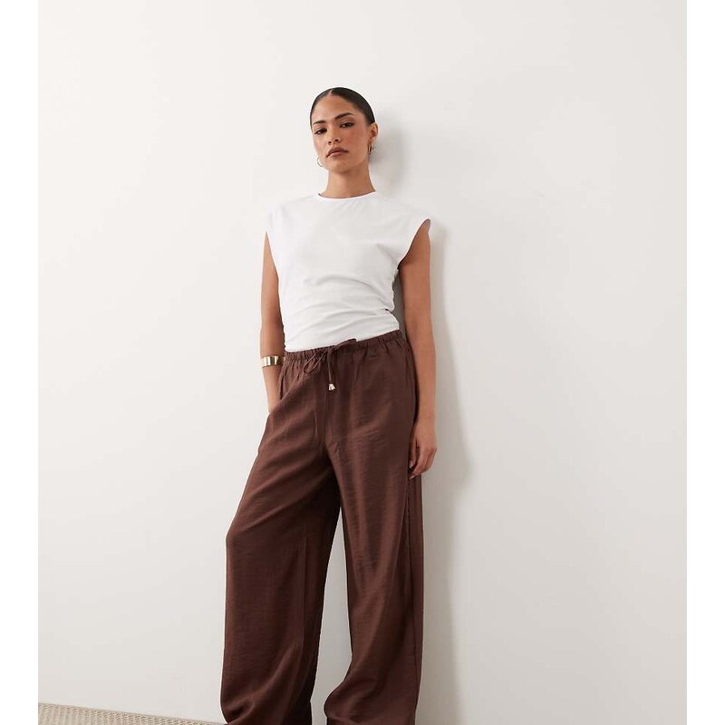 New Look Petite crinkle wide leg trousers in brown 115589645