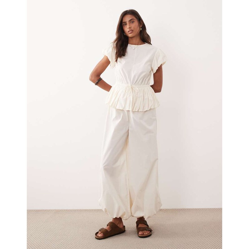 ASOS DESIGN jumpsuit with peplum and balloon legs in cream-White