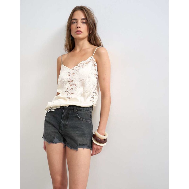 Topshop denim A-line short with rip in washed black