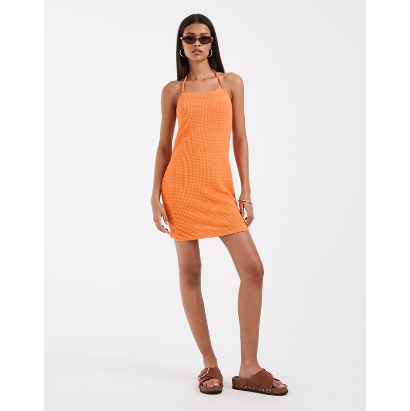 Vero Moda halter neck knitted mini dress in sunset orange