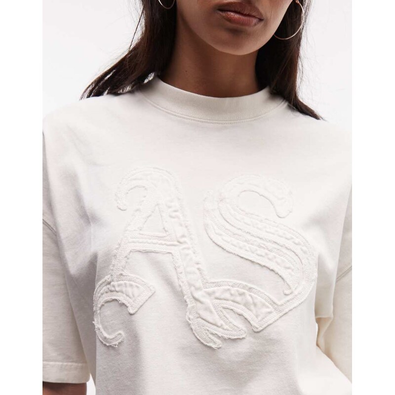 AllSaints Insignia Etta short sleeve distressed logo t-shirt in mallow white-Green