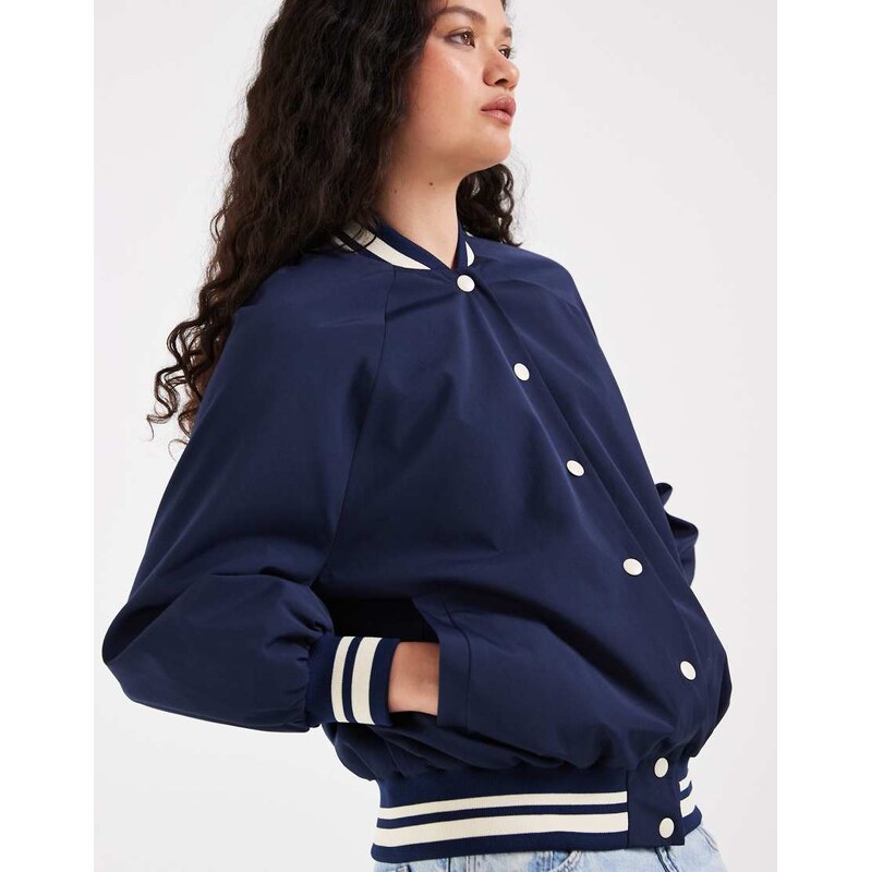 ASOS DESIGN sporty rib trim varsity jacket in navy 115561292