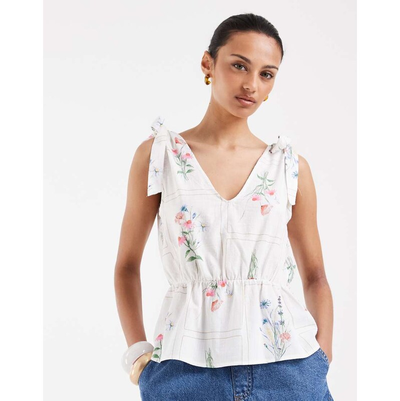 Vero Moda tie shoulder peplum hem top in white based wild flower print 115610170
