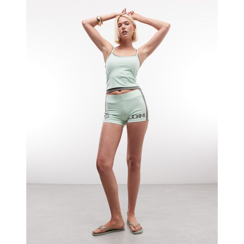 COLLUSION football booty short in green co-ord 115640384