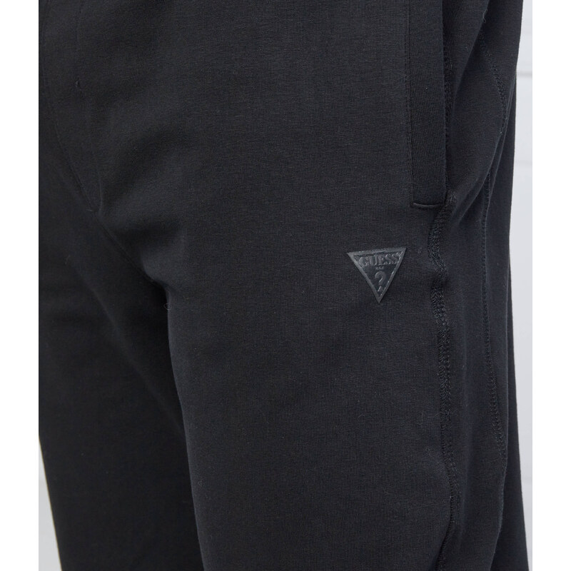 GUESS Tepláky Adam | Relaxed fit
