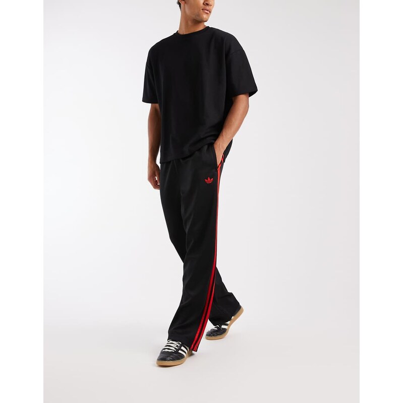 adidas Originals Adicolor loose trackpants in black / vivid red 115682096