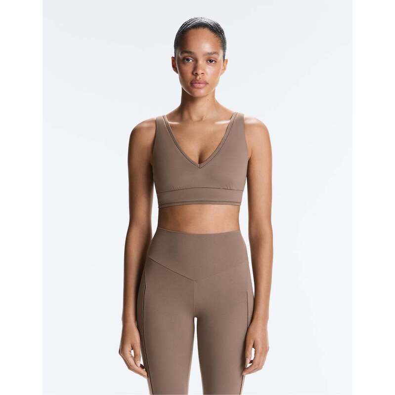 OYSHO Medium-support comfortlux sports bra with hemstitch in brown 115704893