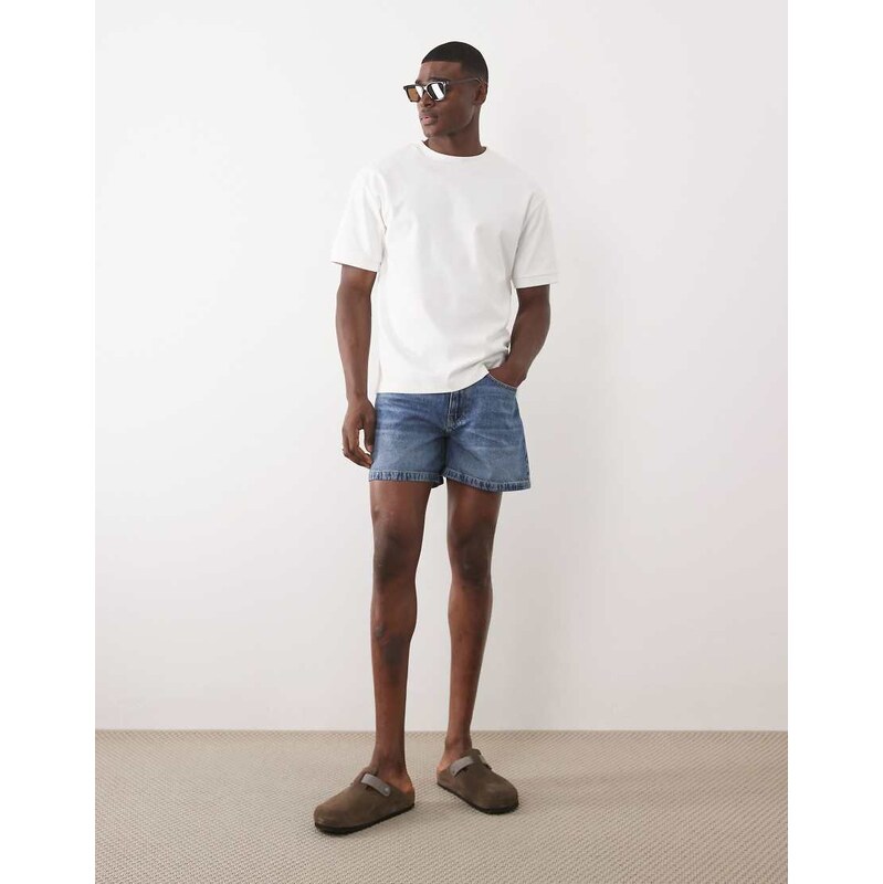 ASOS DESIGN shorter length denim jorts in mid wash blue