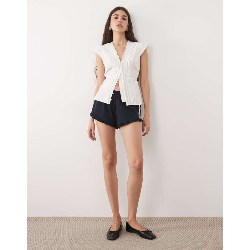 Miss Selfridge varsity mini shorts with frill hem in navy-Blue 115712071