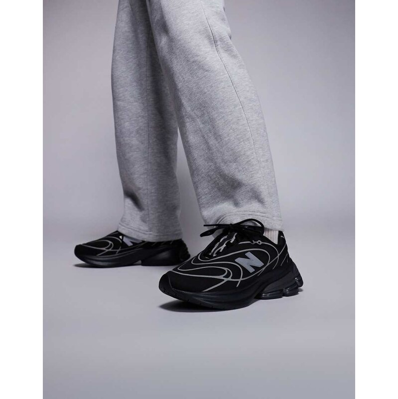 New Balance 5030 in black and metallic silver