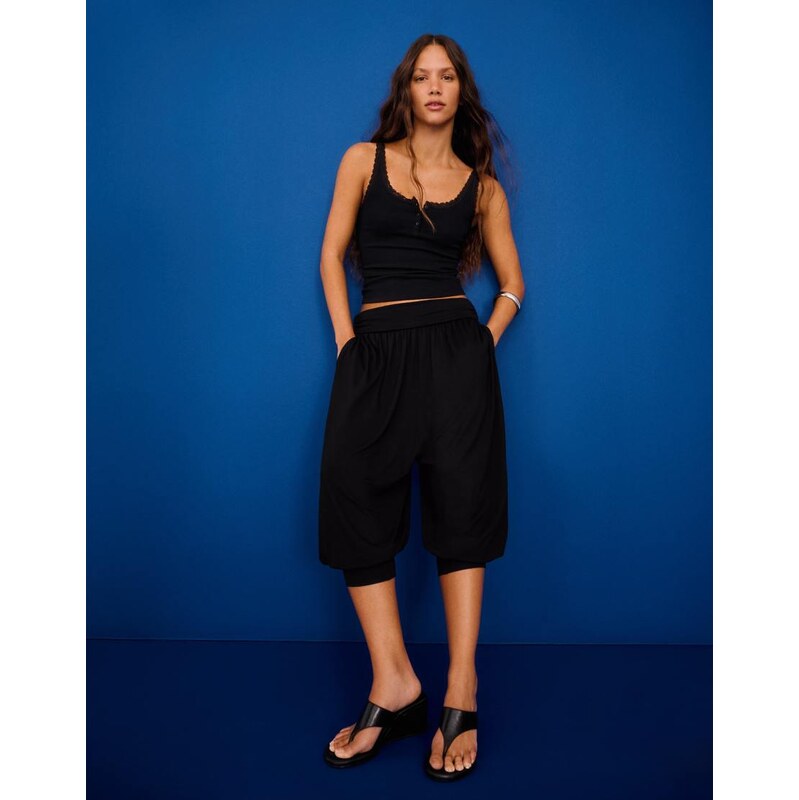 Bershka Capri sarouel trousers in black 115730990