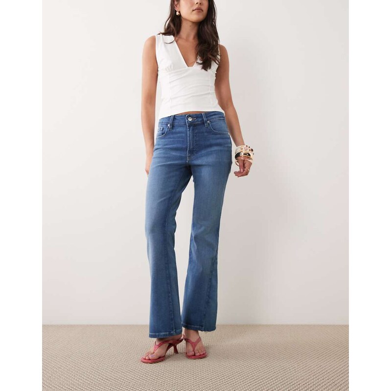 Good American Petite good wait soft tech bootcut jean in mid blue wash 115740722