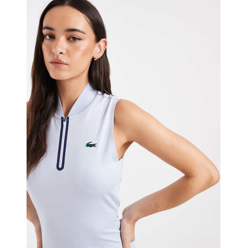 Lacoste Tennis Performance sleeveless 1/4 zip logo polo top in light 115743982