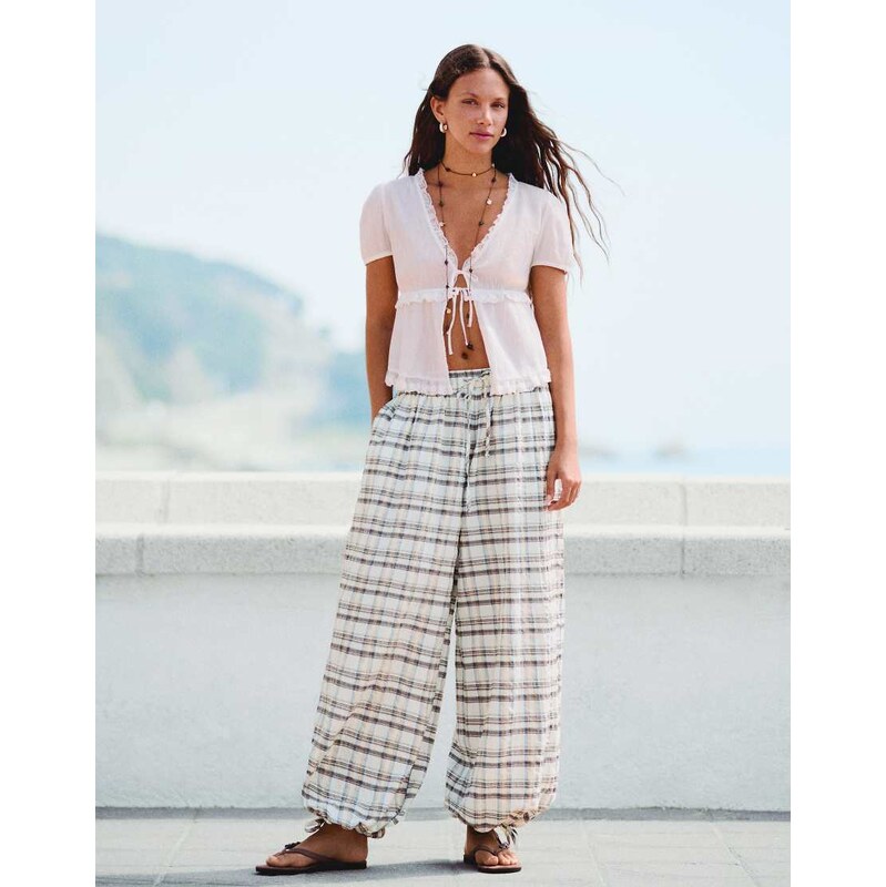 Bershka Checked sarouel trousers in white 115744401