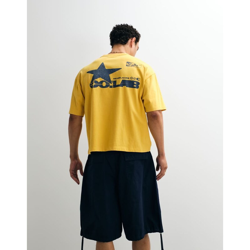 ASOS DESIGN oversized t-shirt with street graphic in yellow wash