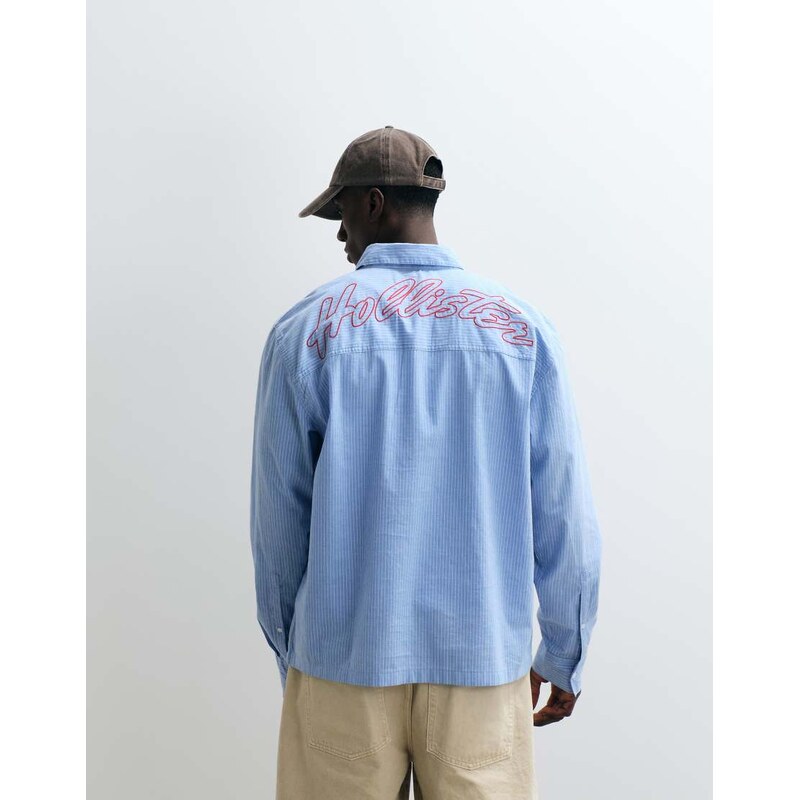 Hollister embroidered logo long sleeve poplin shirt in blue
