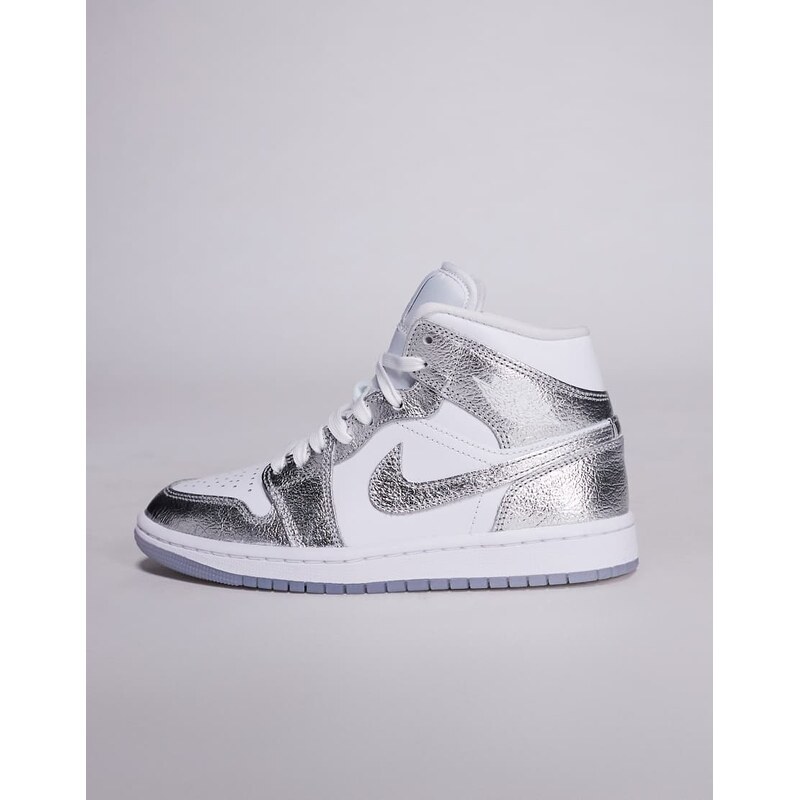 Nike Air Jordan 1 mid trainers in white and metallic silver
