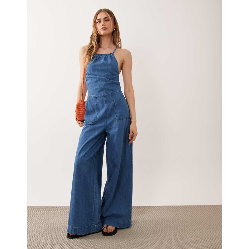 ASOS DESIGN halter neck denim jumpsuit with patch pockets in