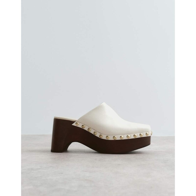 ARRANGE leather studded clogs in bone-White