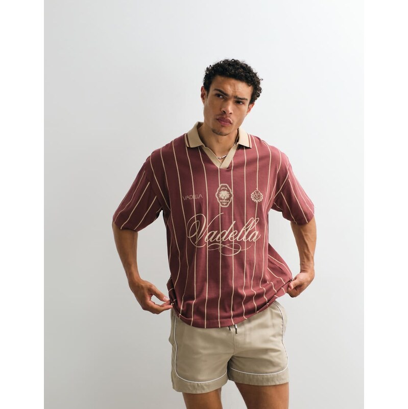 ASOS DESIGN oversized polo with sports graphic in burgundy