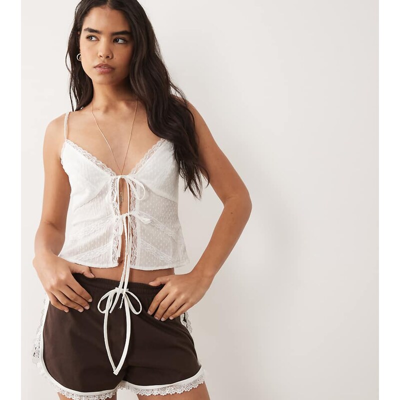 The Frolic exclusive dobby cotton lace trim tie front cami top