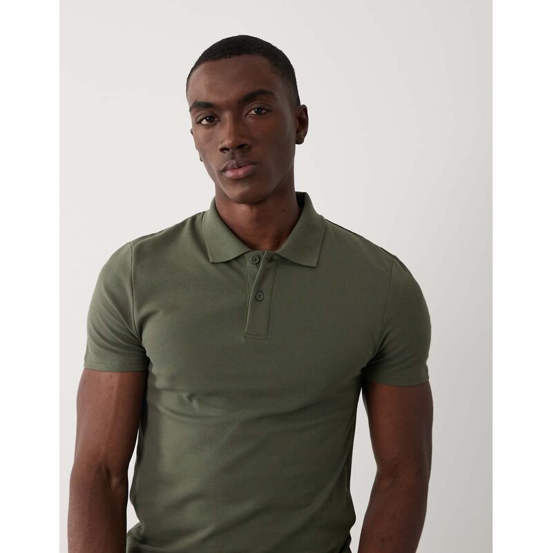 ASOS DESIGN Essentials muscle fit polo in dark green pique