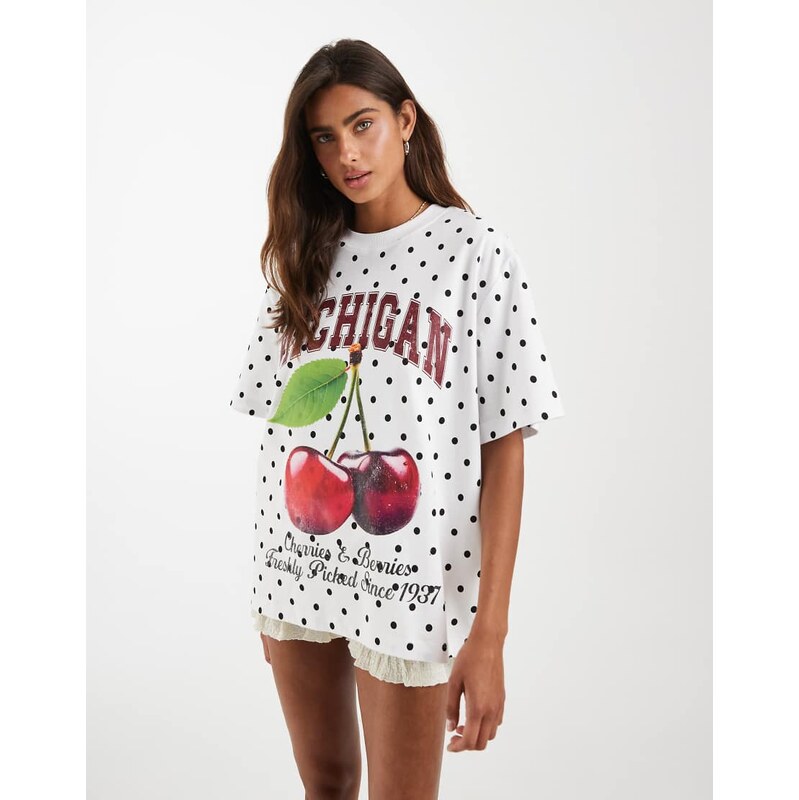 ASOS DESIGN oversized tee with slogan graphic in white polka dot