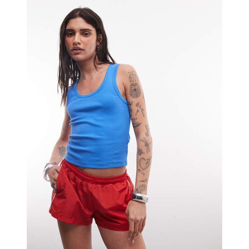 COLLUSION mini track nylon short in red