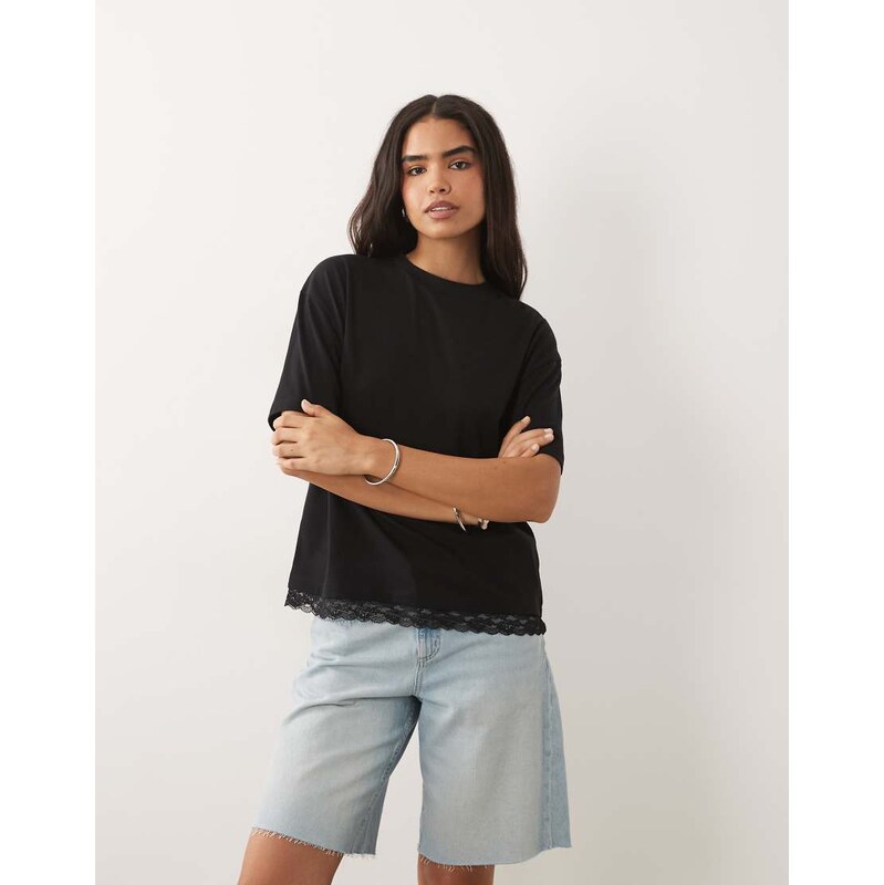 ASOS DESIGN oversized t shirt with lace trim at hem in-Black