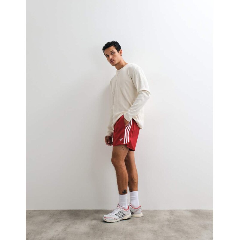 adidas Originals three stripe shorts in red