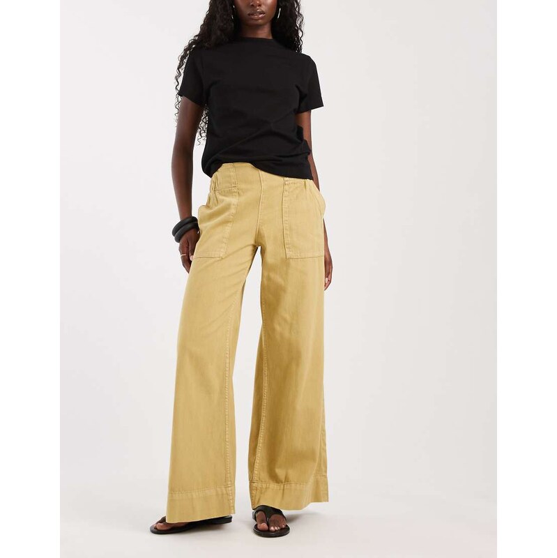 Free People breezy low rise flare pull on trouser in mustard