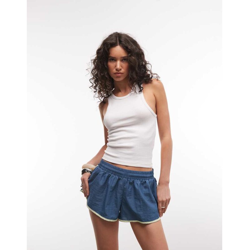 COLLUSION contrast nylon runner shorts in teal-Blue
