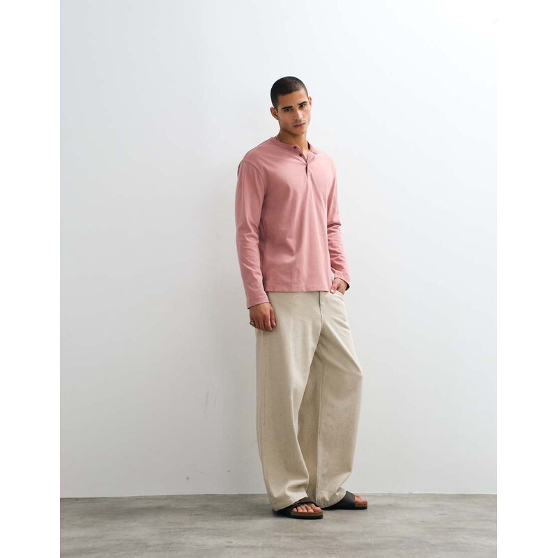 ASOS DESIGN relaxed long sleeve henley t-shirt in pink wash