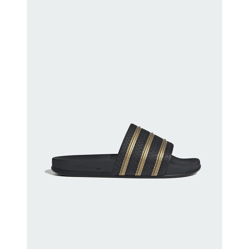 adidas Originals Adilette slides in black and gold