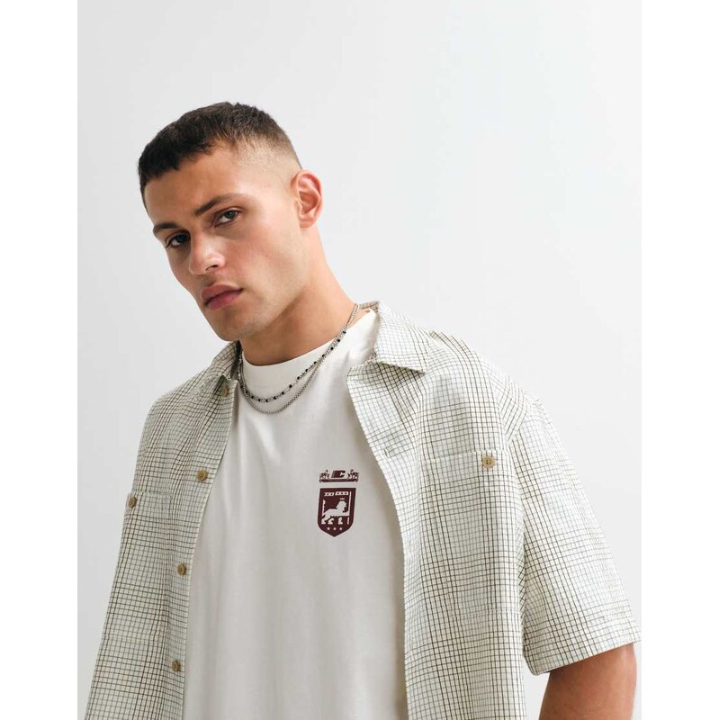 ASOS DESIGN oversized t-shirt with text graphic in cream-White